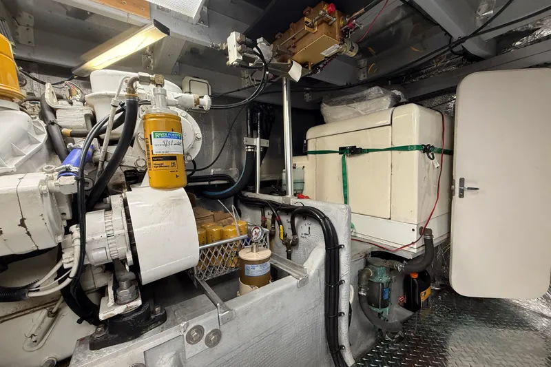 Slide: The Image of Engine room of 1998 Mainship 47 Motor Yacht with mechanical components and equipment. - 70