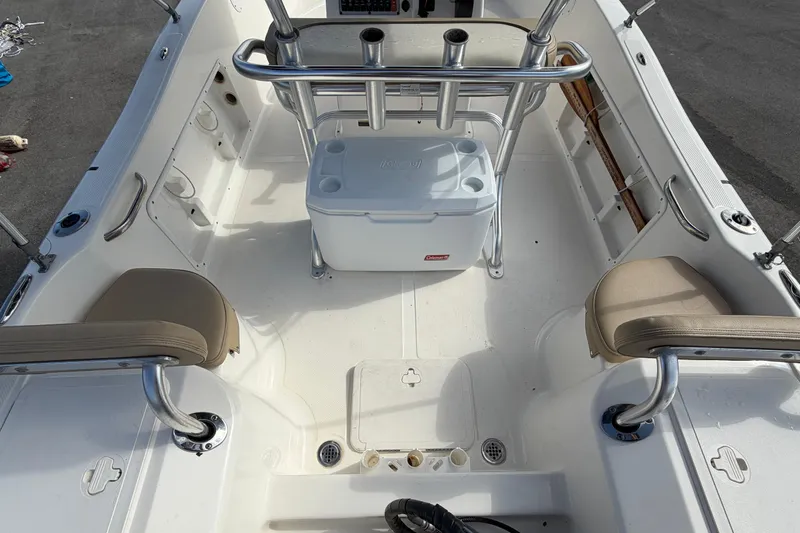 Slide: The Image of 2020 Key West 176 Sportsman CC boat interior with seating and cooler. - 13