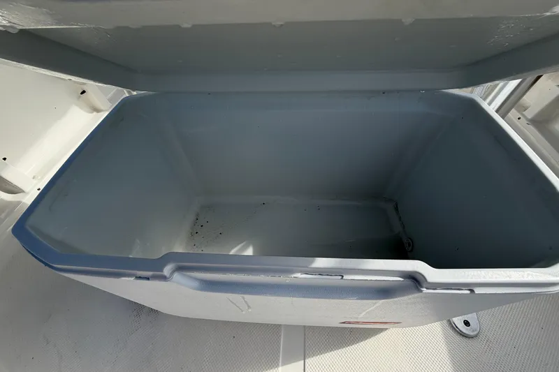 Slide: The Image of Open storage compartment on 2020 Key West 176 Sportsman CC boat. - 17