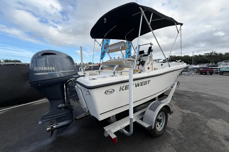 Slide: The Image of 2020 Key West 176 Sportsman CC boat with Yamaha engine on trailer. - 2