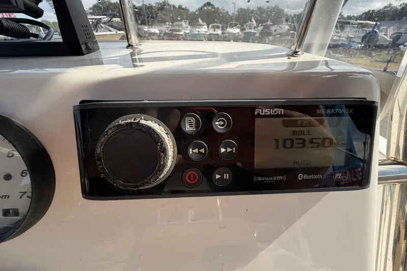Slide: The Image of Dashboard of 2020 Key West 176 Sportsman CC with Fusion marine radio display. - 23