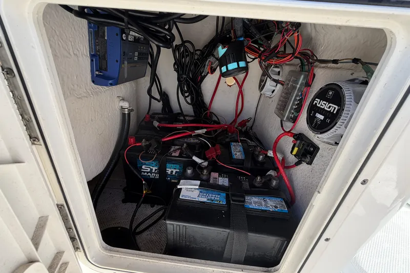 Slide: The Image of Electrical compartment of 2020 Key West 176 Sportsman CC with batteries and wiring. - 28