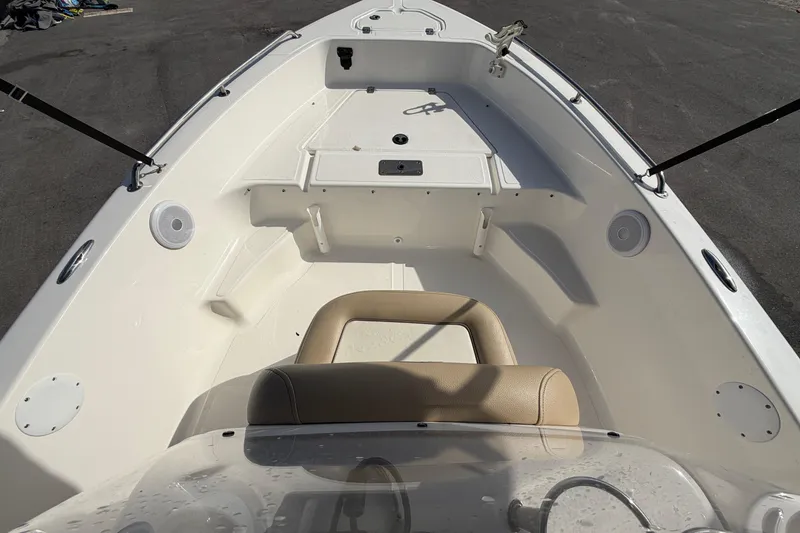 Slide: The Image of 2020 Key West 176 Sportsman CC boat interior with seating and storage compartments. - 30