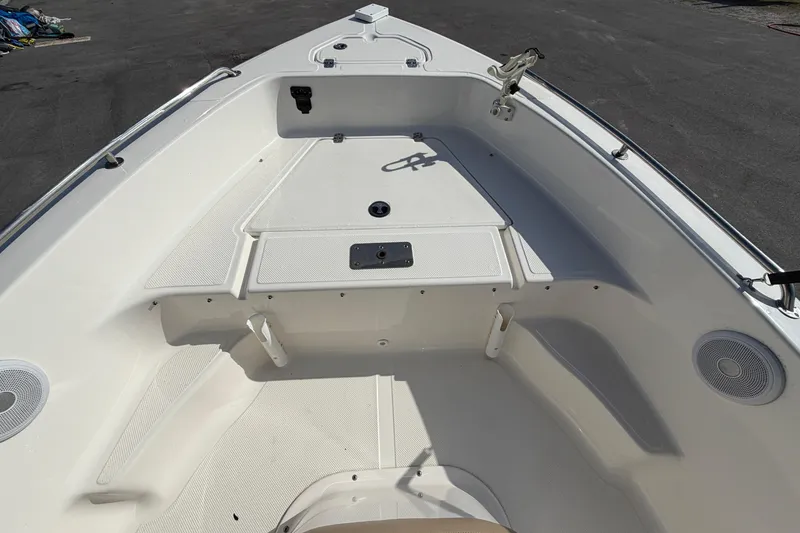 Slide: The Image of 2020 Key West 176 Sportsman CC boat interior, featuring spacious seating and storage areas. - 31