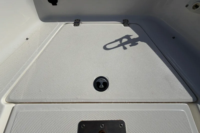 Slide: The Image of 2020 Key West 176 Sportsman CC boat deck with textured surface and shadow. - 32