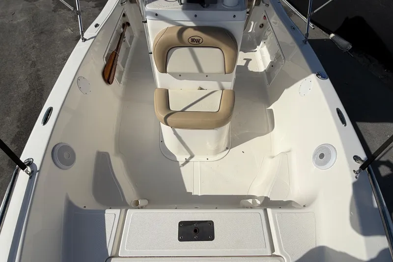Slide: The Image of 2020 Key West 176 Sportsman CC boat interior with seating and storage compartments. - 38