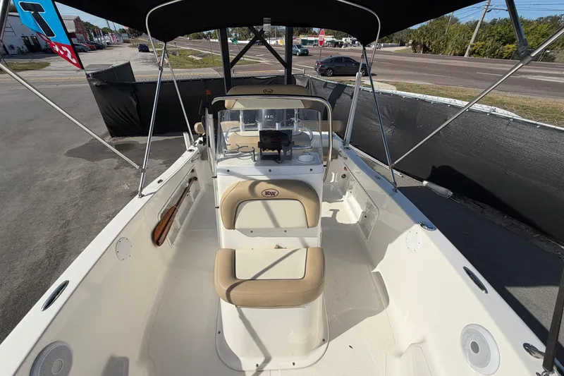 Slide: The Image of 2020 Key West 176 Sportsman CC boat interior with seating and console under canopy. - 39