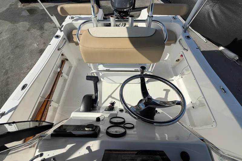 Slide: The Image of 2020 Key West 176 Sportsman CC boat interior with steering wheel and controls. - 43