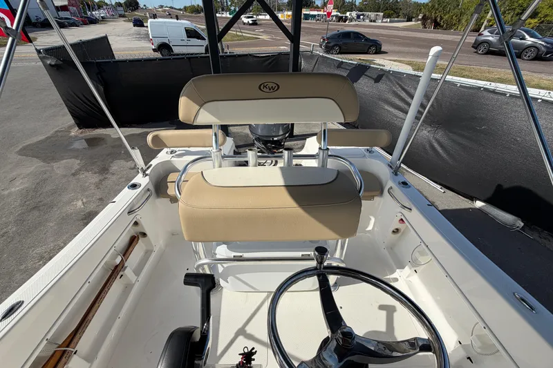 Slide: The Image of 2020 Key West 176 Sportsman CC boat interior with steering wheel and seating. - 44