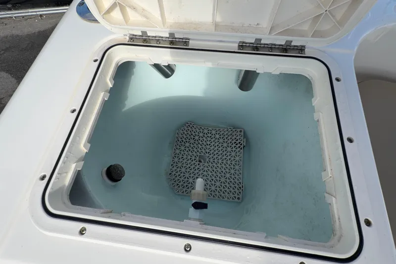 Slide: The Image of Open storage compartment on 2020 Key West 176 Sportsman CC boat. - 49