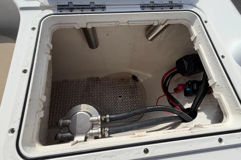 Slide: The Image of Open compartment of 2020 Key West 176 Sportsman CC boat showing wiring and components. - 51