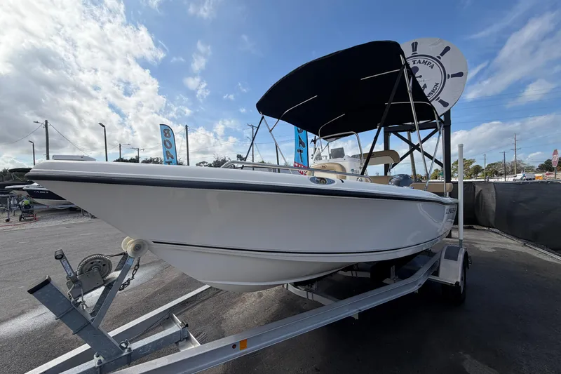 Slide: The Image of 2020 Key West 176 Sportsman CC boat on trailer under blue sky. - 6