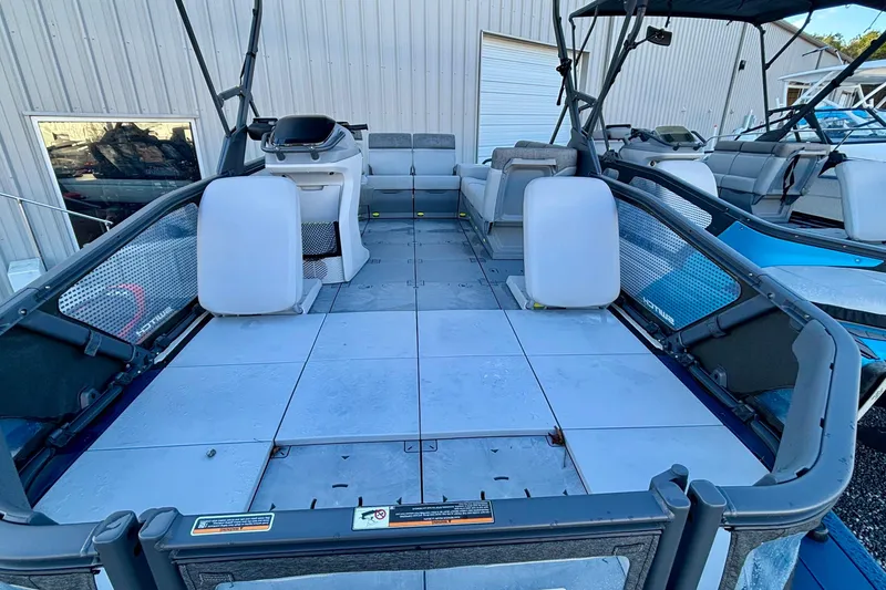 Slide: The Image of 2024 Sea-Doo Switch Sport 18 pontoon boat interior with modular seating and spacious deck. - 11