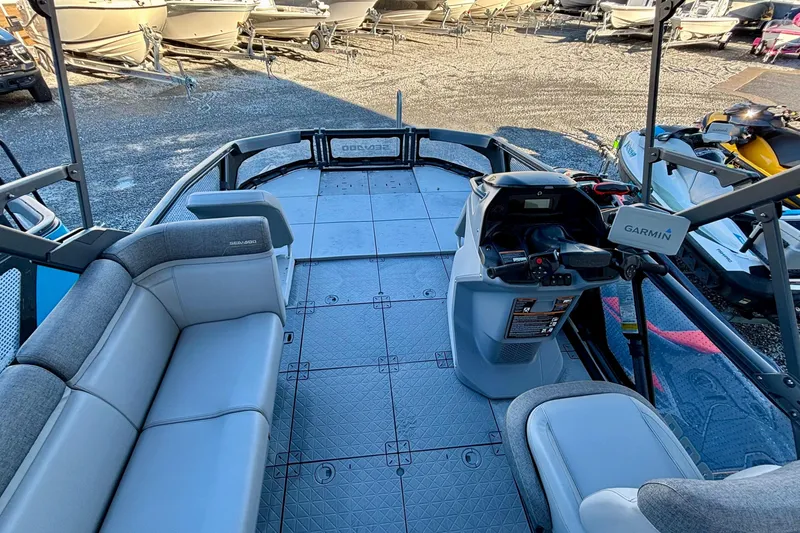 Slide: The Image of 2024 Sea-Doo Switch Sport 18 interior with seating and Garmin navigation system. - 8