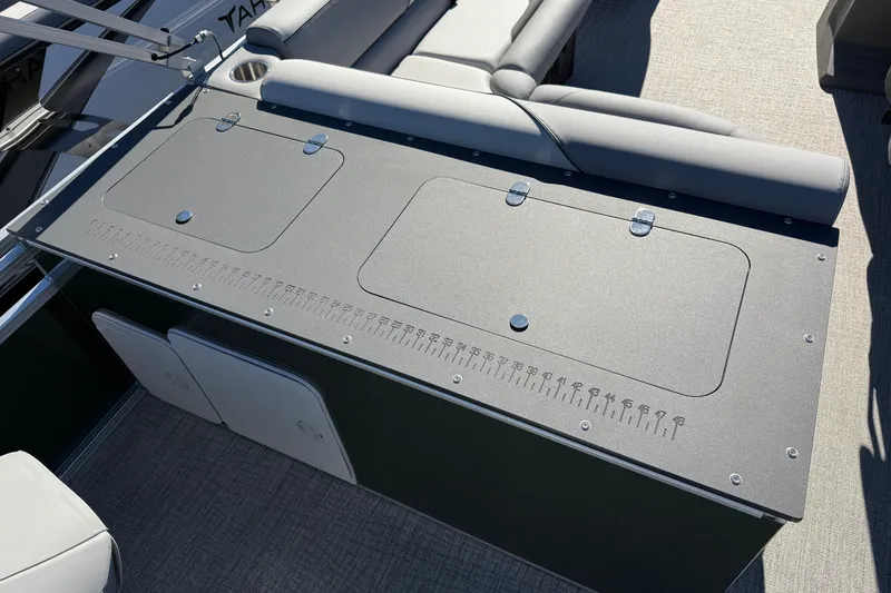 Slide: The Image of 2026 Tahoe Pontoon Sport 85 Rear Fish deck with storage compartments and seating. - 10