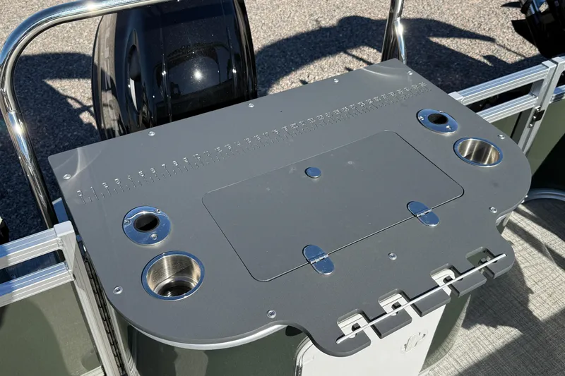 Slide: The Image of 2026 Tahoe Pontoon Sport 85 Rear Fish boat console with cup holders and storage. - 11