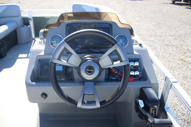 Slide: The Image of 2026 Tahoe Pontoon Sport 85 Rear Fish dashboard with steering wheel and controls. - 6