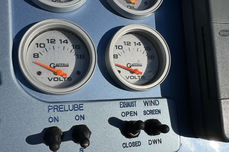 Slide: The Image of Control panel of 2001 Nor-Tech 38 Super Vee with volt gauges and switches. - 4