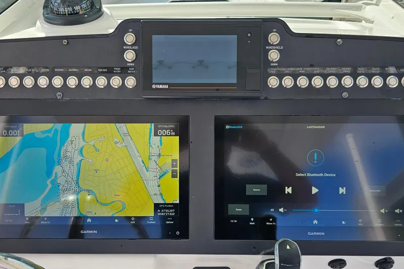 Slide: The Image of Dashboard of 2021 Everglades 273 Center Console with Garmin navigation and control systems. - 15
