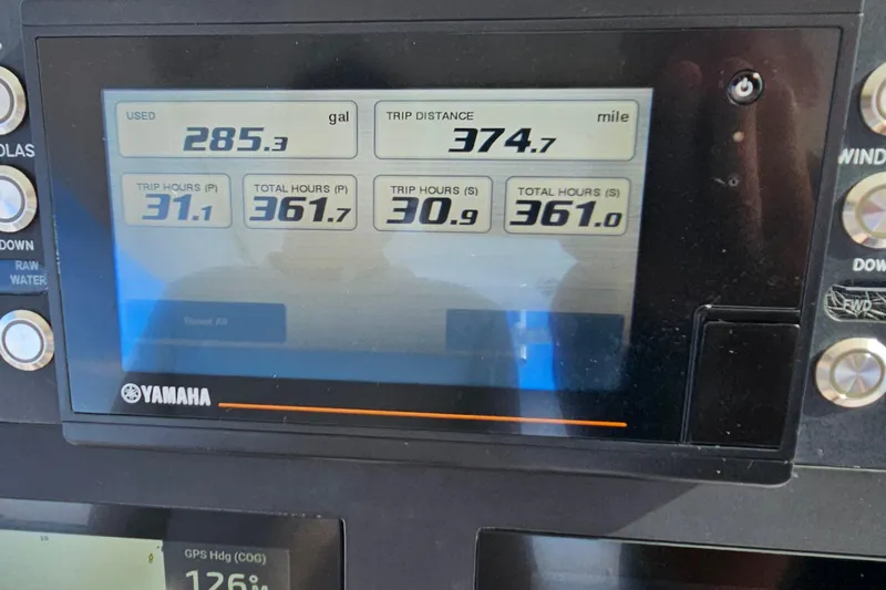 Slide: The Image of Yamaha display on 2021 Everglades 273 Center Console showing fuel and trip data. - 16