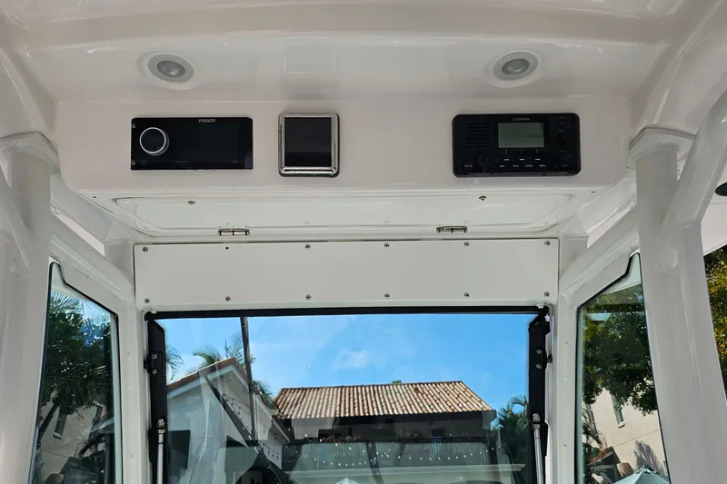 Slide: The Image of 2021 Everglades 273 Center Console interior with electronic controls and clear view. - 19