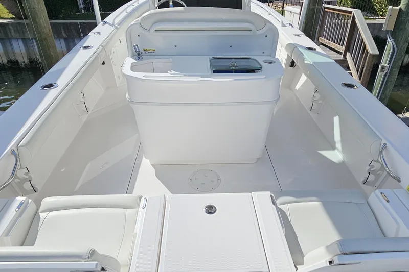 Slide: The Image of 2021 Everglades 273 Center Console boat interior with seating and storage. - 24