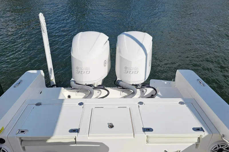 Slide: The Image of 2021 Everglades 273 Center Console with dual Yamaha 300 engines on water. - 28
