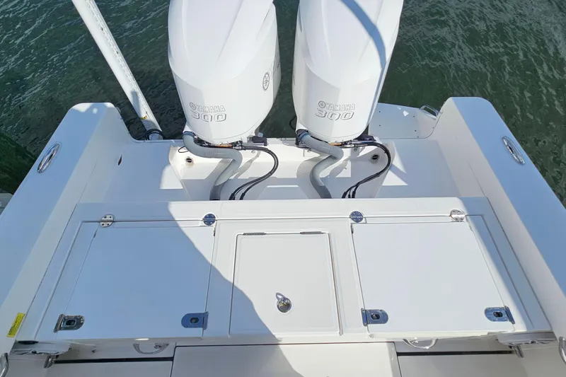 Slide: The Image of 2021 Everglades 273 Center Console with twin Yamaha 300 engines on water. - 29