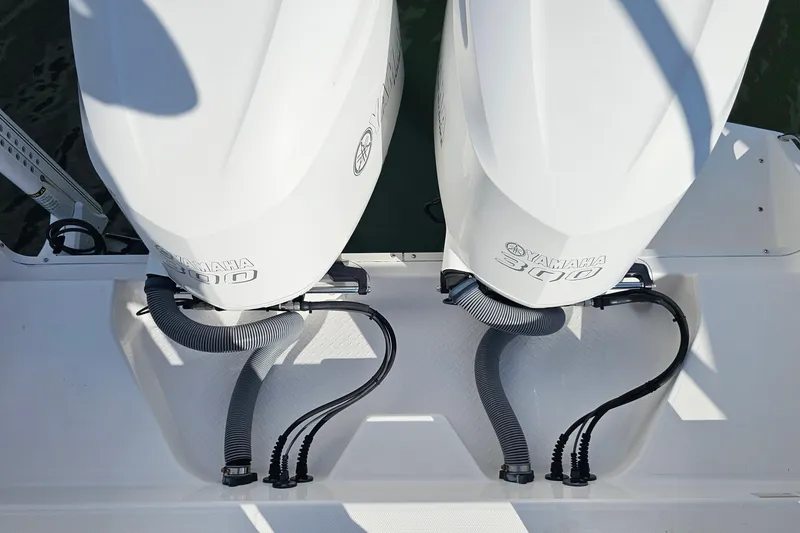 Slide: The Image of Twin Yamaha 300 engines on a 2021 Everglades 273 Center Console boat. - 30