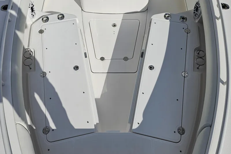 Slide: The Image of 2021 Everglades 273 Center Console boat deck with storage compartments and cup holders. - 34