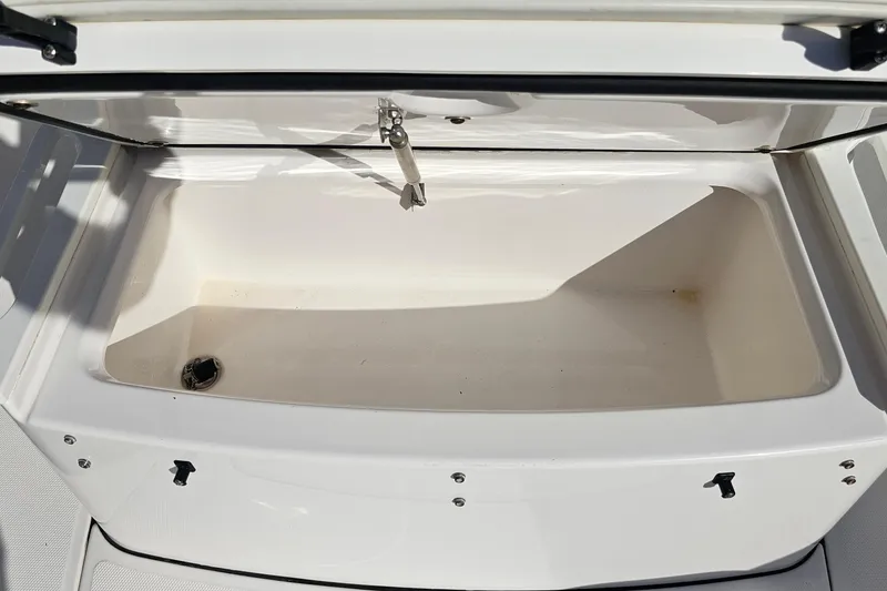 Slide: The Image of Open storage compartment on 2021 Everglades 273 Center Console boat. - 39