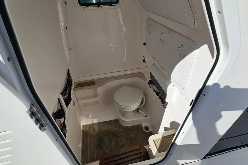 Slide: The Image of Interior of 2021 Everglades 273 Center Console boat with compact marine toilet. - 46