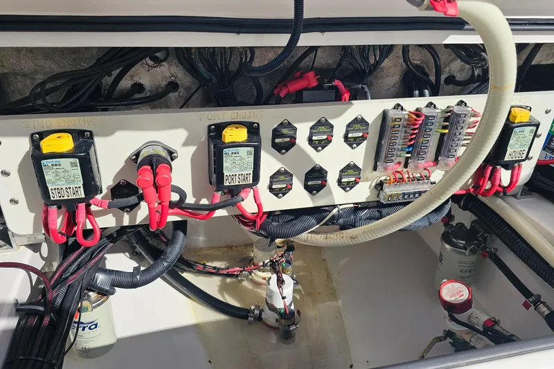 Slide: The Image of Electrical panel of 2021 Everglades 273 Center Console boat with wiring and circuit breakers. - 48