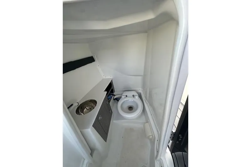 Slide: The Image of 2022 Monterey 255SS Super Sport boat interior bathroom with sink and toilet. - 13