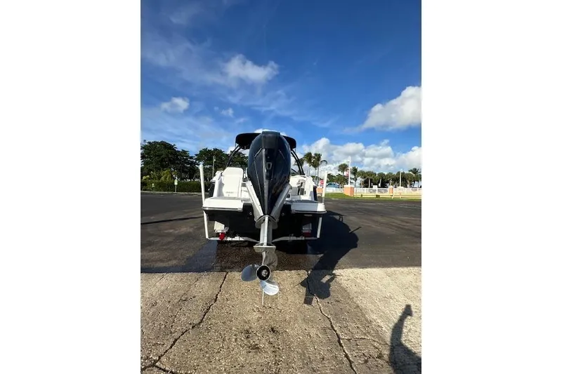 Slide: The Image of 2022 Monterey 255SS Super Sport boat on trailer, rear view under clear blue sky. - 20