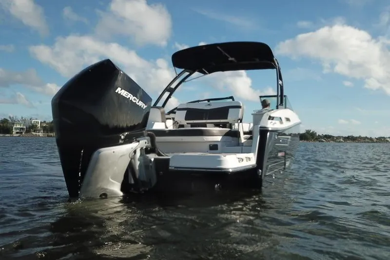 Slide: The Image of 2022 Monterey 255SS Super Sport boat on water, rear view with Mercury engine. - 5
