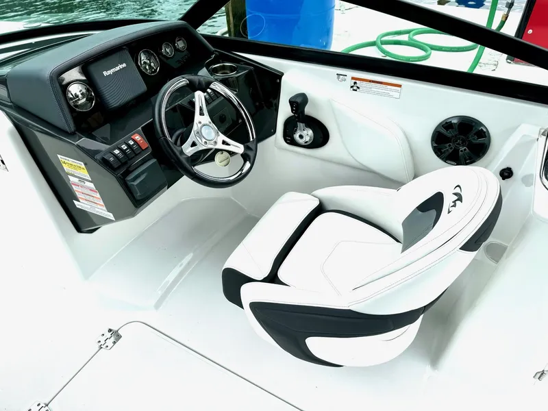 Slide: The Image of 2018 Monterey M-45 boat cockpit with steering wheel and white captain's chair. - 4