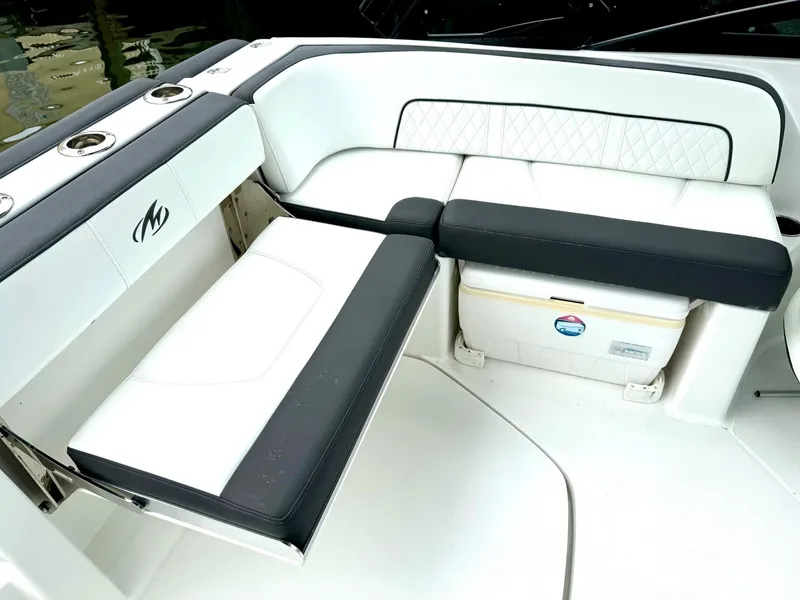 Slide: The Image of 2018 Monterey M-45 boat seating area with white and black upholstery. - 6