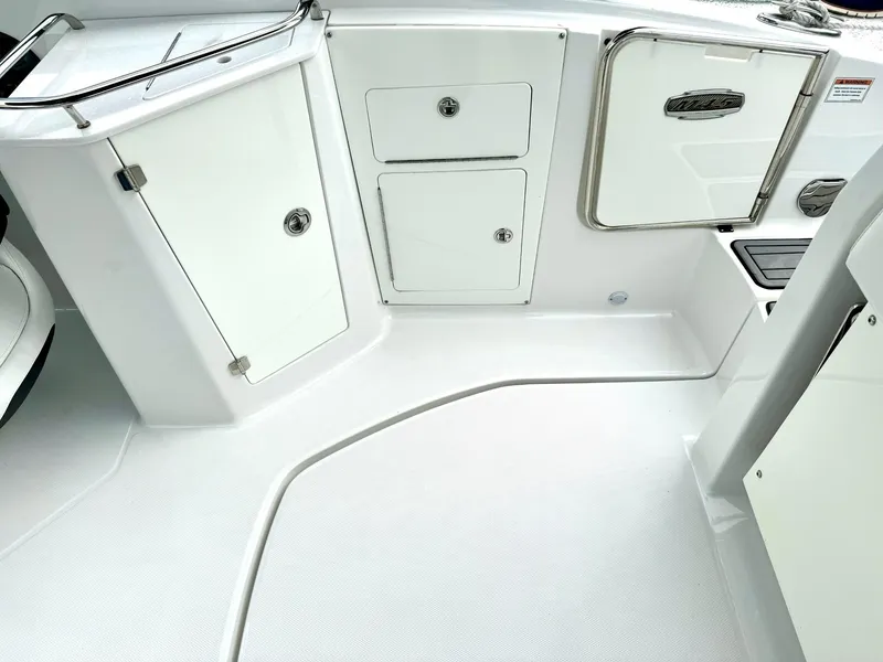 Slide: The Image of 2018 Monterey M-45 boat interior with white storage compartments and sleek design. - 7