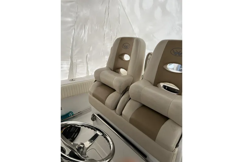 Slide: The Image of Luxury seating on 2016 Southport 272 FE boat, featuring plush beige upholstery. - 3