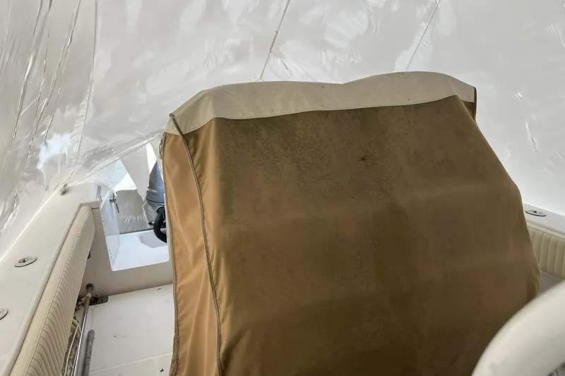 Slide: The Image of 2016 Southport 272 FE boat interior with covered console and seating. - 7