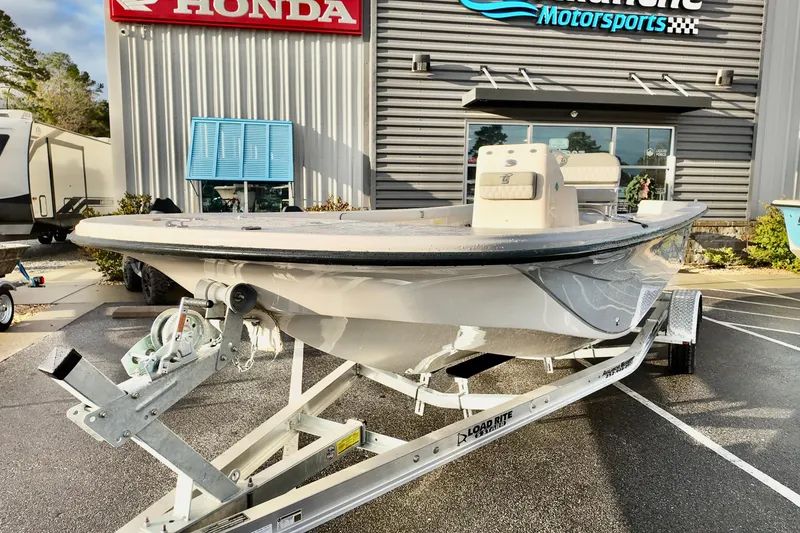Slide: The Image of 2026 Carolina Skiff 21 LS boat on trailer outside dealership. - 10