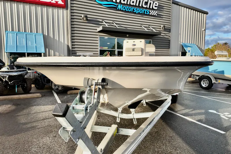 Slide: The Image of 2026 Carolina Skiff 21 LS boat on trailer at dealership. - 9