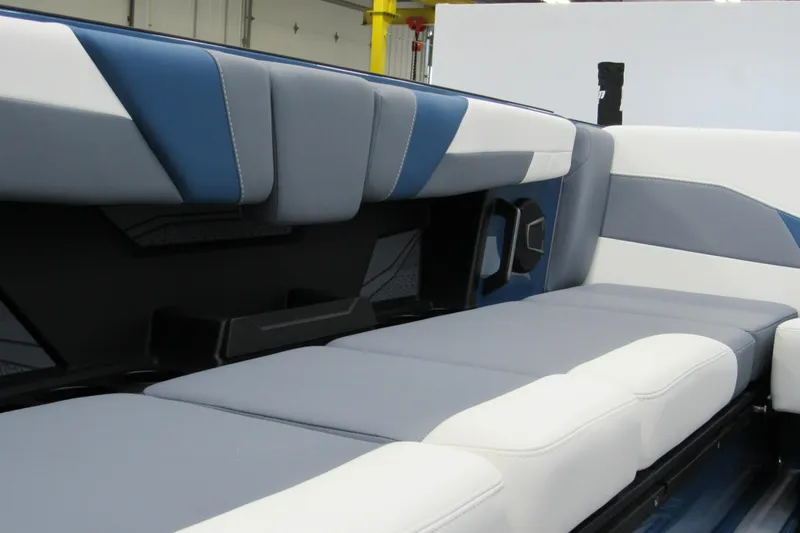 Slide: The Image of 2026 Axis T250 boat interior with blue and white cushioned seating. - 12