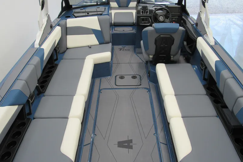 Slide: The Image of 2026 Axis T250 boat interior with blue and gray seating, modern design. - 4