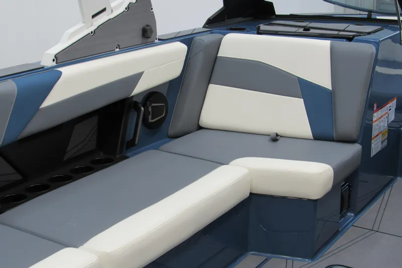 Slide: The Image of 2026 Axis T250 boat interior with blue and white cushioned seating. - 6