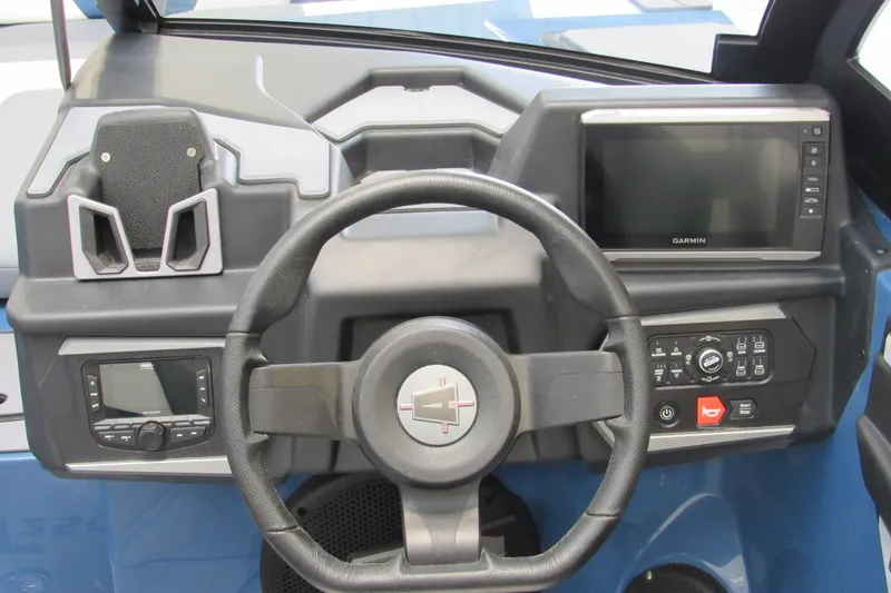 Slide: The Image of Steering console of 2026 Axis T250 boat with Garmin display and controls. - 9