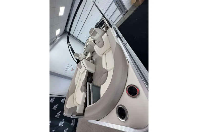 Slide: The Image of 2026 Avalon 2385 LSZ pontoon boat interior with luxurious seating and cup holders. - 22