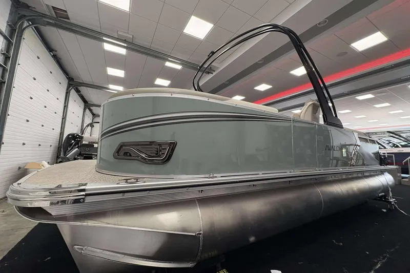 Slide: The Image of 2026 Avalon 2385 LSZ pontoon boat displayed indoors, showcasing sleek design and modern features. - 3