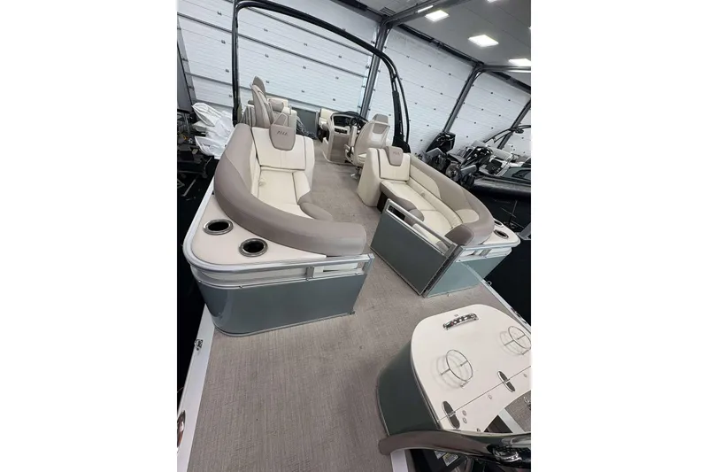 Slide: The Image of 2026 Avalon 2385 LSZ pontoon boat with luxurious seating and modern design in showroom. - 9